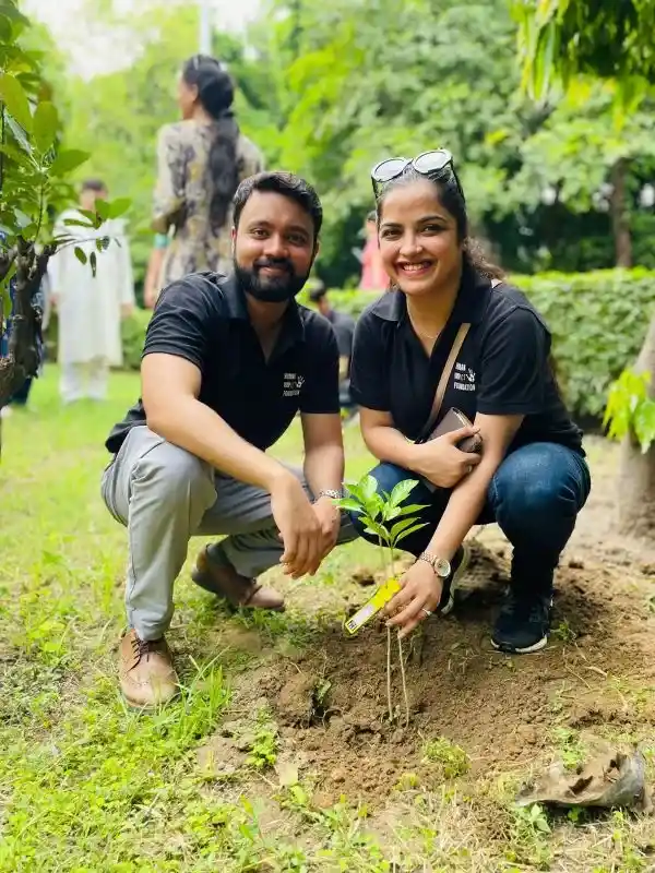 Volunteers planting a tree